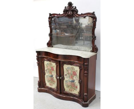 A Victorian mahogany marble-top mirror-back chiffonier with Rococo framed mirror with stylised acanthus cartouche above serpe