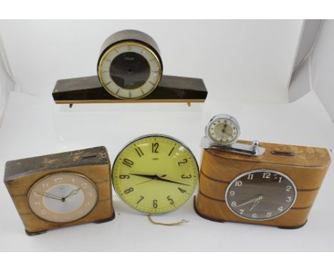 Five vintage clocks to include an Art Deco style mantel clock, a c1950s Metamec wall clock, Kenzle Napoleon hat clock and a w