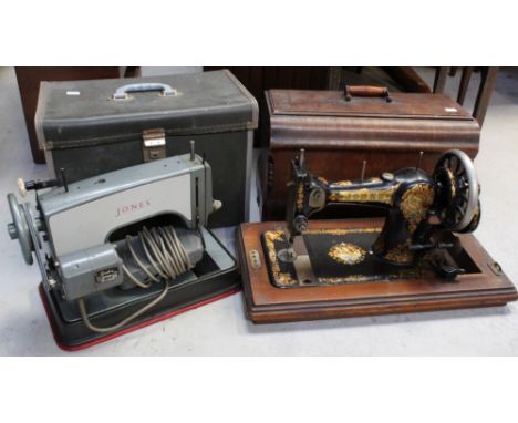 A walnut-cased Edwardian Jones hand-cranked sewing machine, no.288806 to plaque on base, in black with transfer-printed gold,