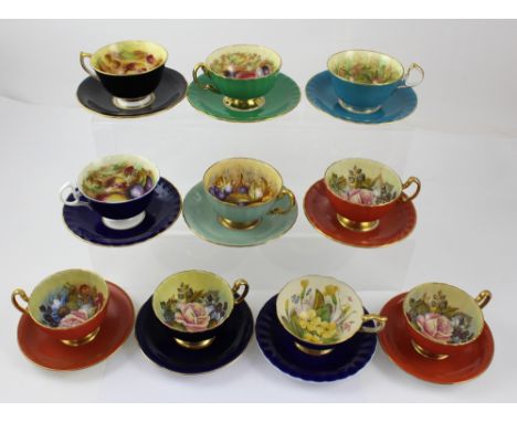 Ten Aynsley printed and hand-painted cups and saucers, five painted with spring and summer flowers, signed JA Bailey and five