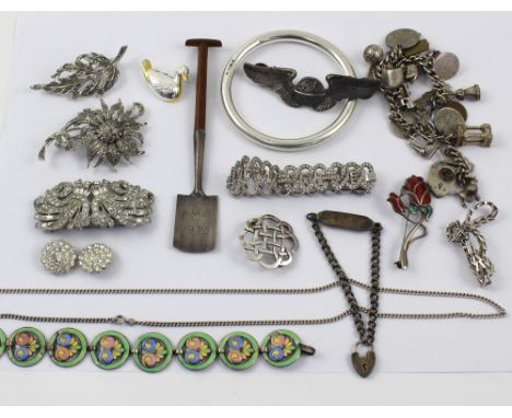 A collection of silver jewellery to include a silver charm bracelet, enamelled silver disc bracelet, silver duck brooch with 