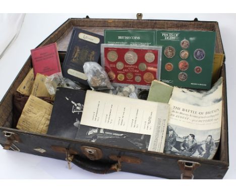 A vintage black metal suitcase containing a quantity of coins to include commemorative sets of, 'Farewell To The Pound, Shill