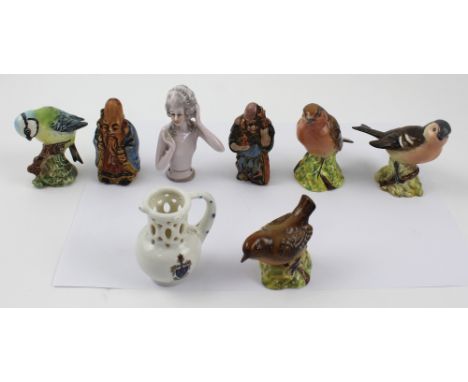 A mixed lot of ceramics to include a Beswick robin, blue tit, chaffinch and wren, an early 20th century porcelain pin doll, a