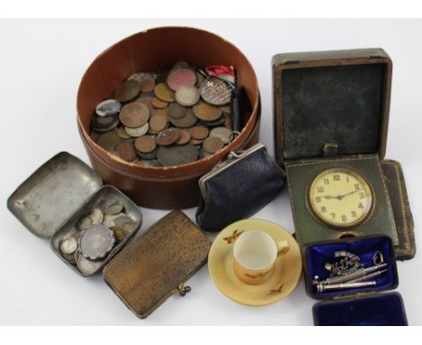 An early 20th century travelling alarm clock, the gilded dial set with Arabic numerals, in a leather travelling case, an Edwa