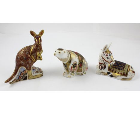 Three Royal Crown Derby paperweights, the polar bear, the donkey and the kangaroo with joey, height 15cm, each with gold stop