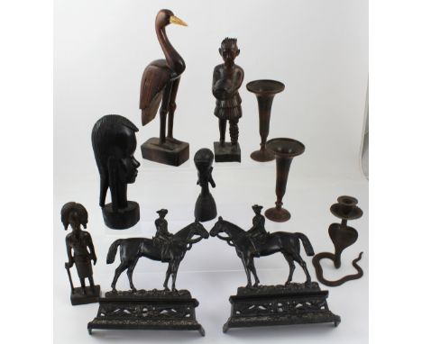 An African lot to include five carved figurines to include a stork, warrior, lady etc, a pair of metal trumpet vases, a metal