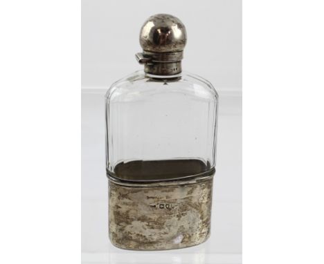 A Victorian silver-mounted cut glass hip flask with silver beaker sleeve, Charles James Fox, London 1895, height 15.5cm.