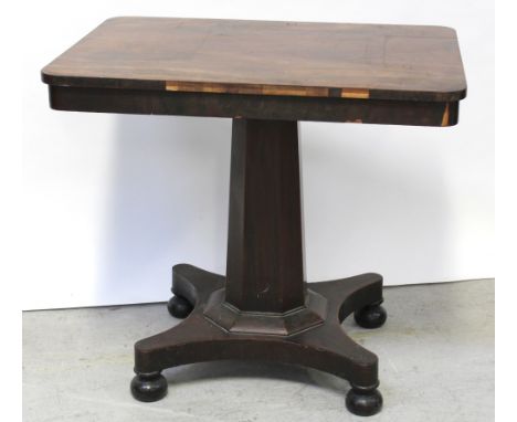 A Victorian mahogany rectangular side table on octagonal pillar support to quadripartite base to bun feet, 69 x 54cm (af).