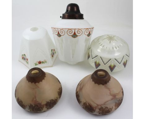 A selection of early-to-mid 20th century glass lamp shades to include two marbled brown cameo glass examples decorated with f