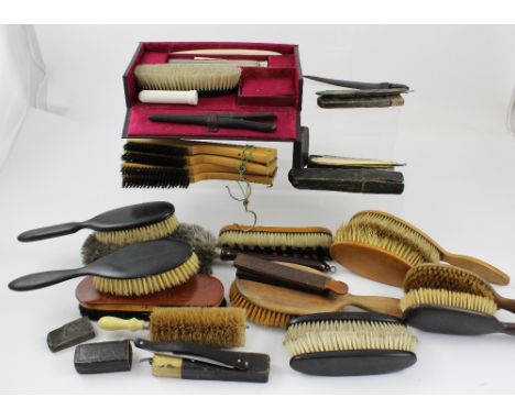 A small collection of vintage straight razors, metallic strop and a collection of various house brushes.