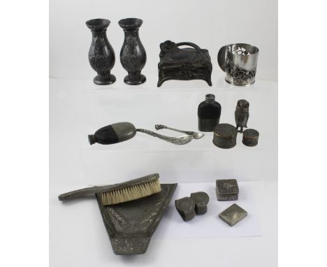 A collection of interesting pewter items to include a matched pair of design reform school pewter vases decorated with daffod