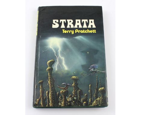 Terry Pratchett; a first edition 'Strata' published London Colin Smythe 1981, in unclipped dust jacket and dated 1981. CONDIT