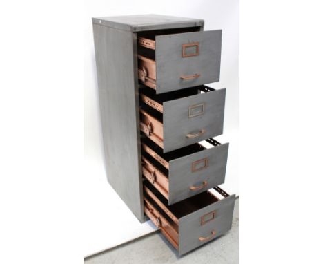 A vintage brushed steel four-drawer filing cabinet with foolscap drawers, approx height 130cm.