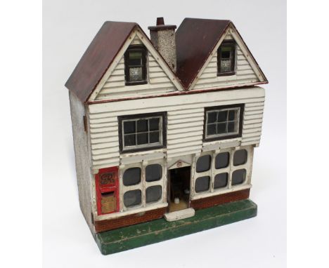 A vintage mid-20th century twin-gabled post office dolls' house with George V post to one end, period scratch-built and shop-