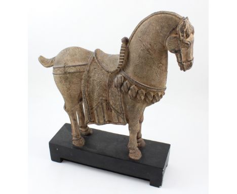 An ornamental ceramic Tang-style horse on black painted wooden base, height 47.5cm.