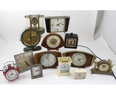 A quantity of vintage clocks to include Fairyram alarm clock, an eight-day carriage clock, c1960s mantel clocks, a vintage Fe