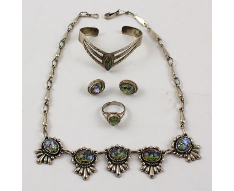 A suite of faux black opal silver-mounted jewellery to include necklace, wishbone-shaped bangle, a pair of earrings and a rin