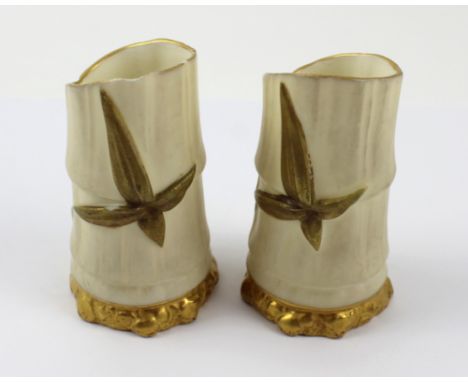 A pair of Royal Worcester posy vases, no1049, date mark for 1899, each modelled as a stem of bamboo (one af), height of each 