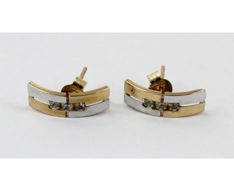A pair of 9ct yellow and white gold bar stud earrings, each set with three small white stones, approx combined 0.7g.