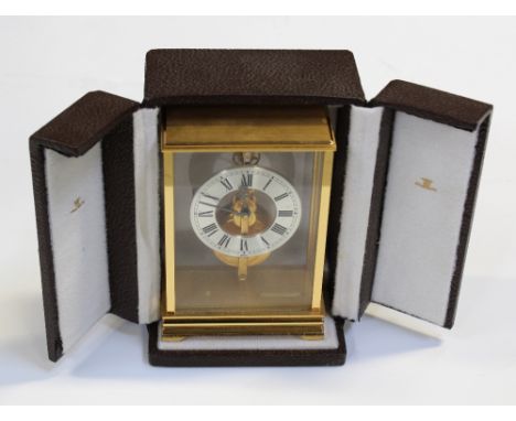 A Jaeger le Coultre 533 carriage clock, the dial set with Roman numerals and gold-plated works, illusion-mounted in glass cas