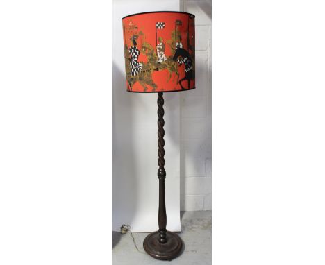 A stained oak barleytwist standard lamp on platform base, approx height 150cm.