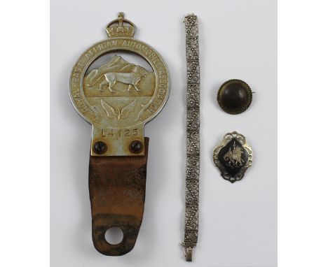 An early 20th century Royal East African Automobile Association car badge, a silver and marcasite Art Deco style bracelet, a 