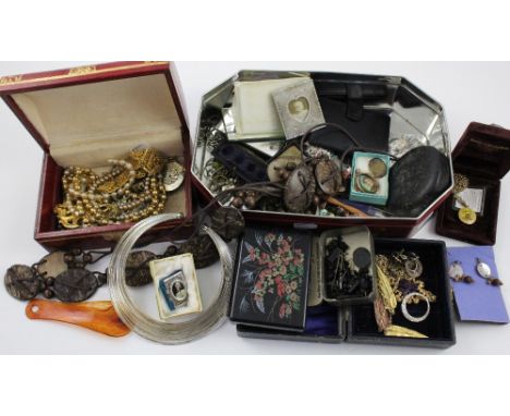 A quantity of vintage and contemporary costume jewellery to include faux pearl necklaces, costume brooches, earrings, bangles