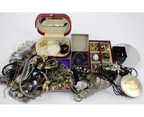 A quantity of vintage and contemporary costume jewellery to include earrings, brooches, necklaces, pendants, snake chain etc.