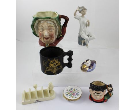 A boxed Royal Doulton D7033 'Dennis and Gnasher' character jug, height 11cm, an Apollo 11 black glazed mug by Portmeirion com