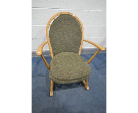 AN ERCOL WINDSOR ELM ROCKING, model 315, with military green seat and back cushions (the chair cushions does not comply with 