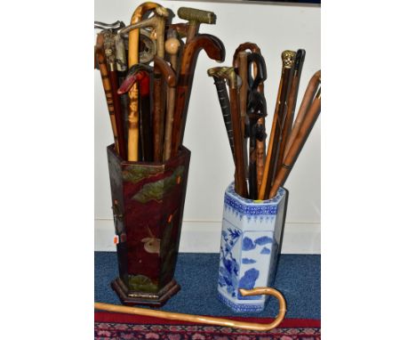 A CHINOISERIE HEXAGONAL STICK STAND, and a Chinese blue and white porcelain stick stand, both containing a variety of walking