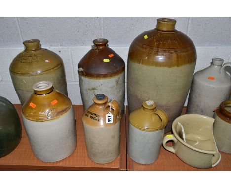 A QUANTITY OF STONEWARE JARS AND FLAGONS, etc, with two vintage bottle vases, the tallest flagon being 50cm high, no stopper,