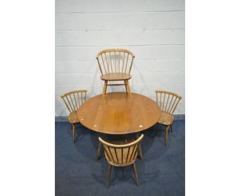 AN ERCOL WINDSOR OVAL TOP DINING TABLE, open length 125cm x closed length 65cm x depth 112cm x height 71cm, three bow top cha