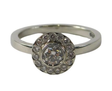 A David Fowkes of Lincoln platinum diamond dress ring, with round brilliant cut centre stone approx 0.42cts in rub over setti