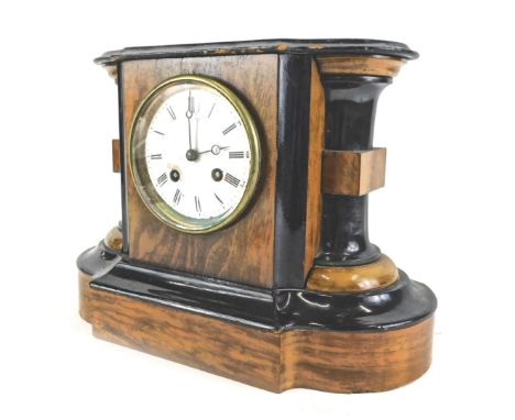 A late 19thC French walnut and ebonised mantel clock, the white enamel dial with Roman numerals, 30cm wide. (AF) 