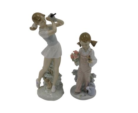 A Lladro porcelain figure of a girl, aside watering can holding bird and flowers, number 5217, printed and impressed marks be