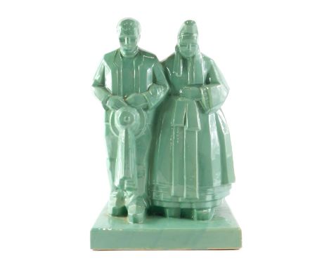 A 20thC French Quimper celadon glazed figure, of lady and gentleman, by Emile Bachelet for The Henriot Faiencerie Quimper, c1