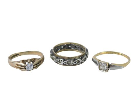Three dress rings, comprising a 9ct gold CZ set solitaire ring, ring size J, an 18ct gold and platinum diamond set dress ring