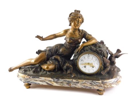 A late 19thC French bronzed spelter figural mantel clock, model in the form of a reclining lady with birds etc. the enamel di