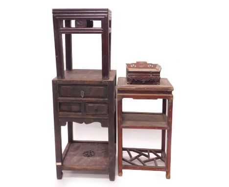 A Chinese urn table, with an arrangement of three drawers, and a pierced and carved under tier, two further urn tables, and a