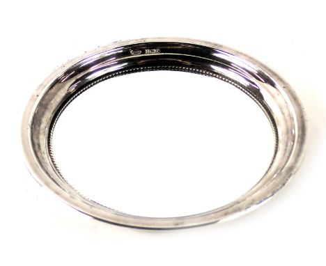 An Elizabeth II silver trinket tray, of circular form, with a beaded outer border and mirror plate, maker B&amp;Co, Birmingha
