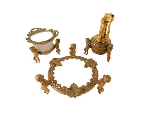Three French gilt ornamental wares, comprising campana vase, pin dish and lighter, each relief moulded with cherubs and vines