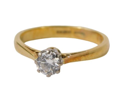 An 18ct gold diamond solitaire ring, the round brilliant cut diamond approximately 0.35ct, in claw setting, in a raised shank