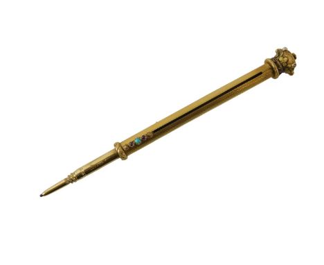 A yellow metal pencil case, the crown top set with seed pearls and garnets, with flowers on an engine turned body with turquo