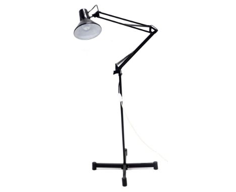 A floor standing black metal Anglepoise type lamp, on X shaped base.    