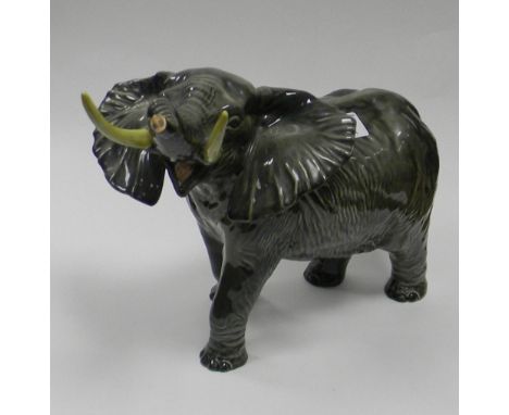 Beswick large Elephant with trunk in Salute: Model 1770, height from tallest point approx. 30cm. 