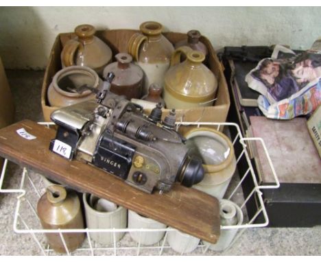 A large collection of stoneware jars and flagons: together with hard back books, butchers scales, A Singer 246k Overlocker Se