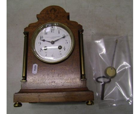 A Goldsmiths and Silversmiths Company Paris Made inlaid mantle clock: with pendulum and key. 