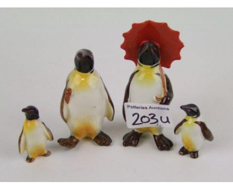 Beswick penguin with umbrella 802: penguin with walking stick 803 and 2 penguin chicks (4). 