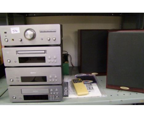 A Denon personal component system D-F10: amplifier, stereo tuner, tape deck, disc player, with speakers, manual, remote and a